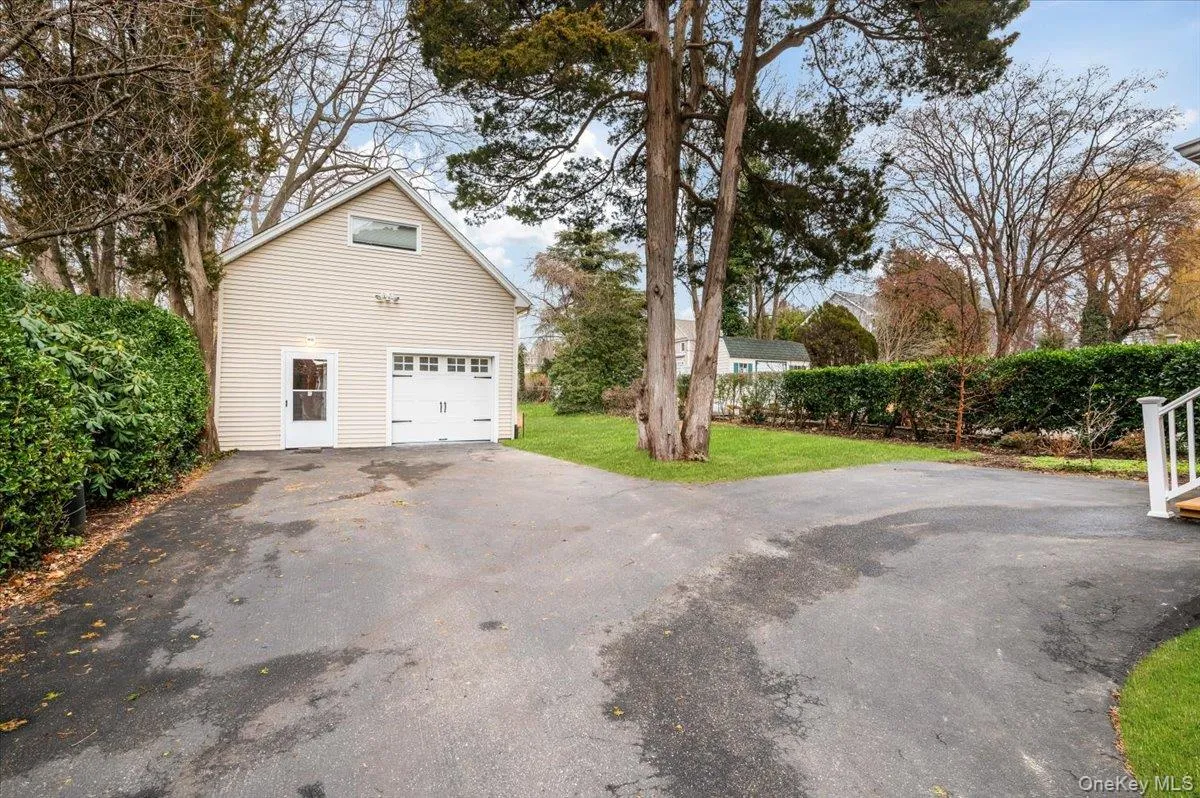 Garage with asphalt driveway Garage with asphalt driveway