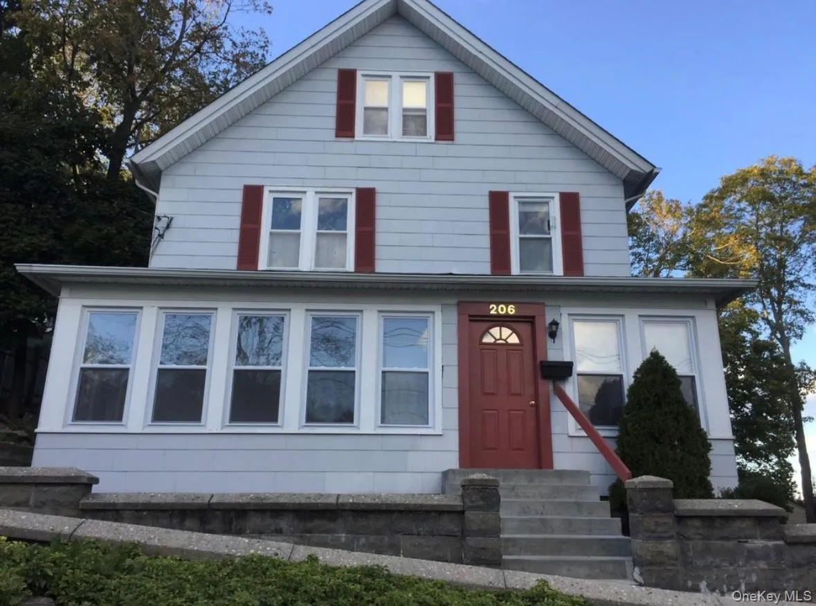 Traditional style home featuring entry steps Traditional style home featuring entry steps