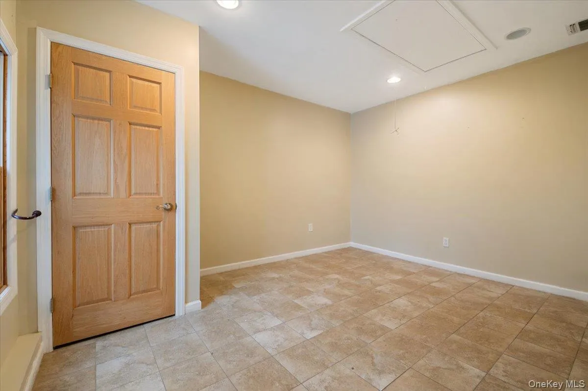 Spare room with recessed lighting and attic access Spare room with recessed lighting and attic access
