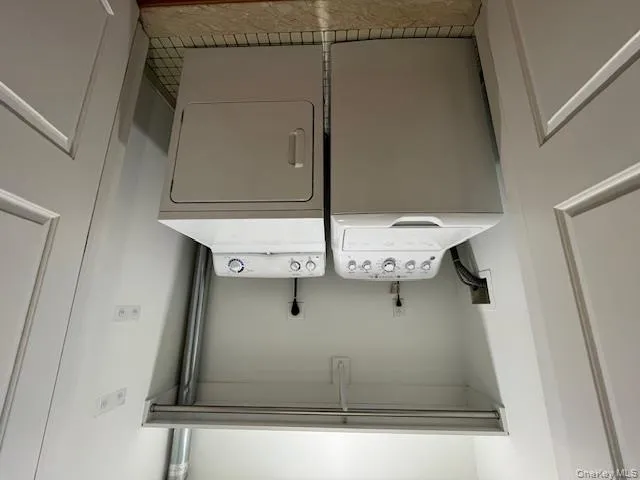 Washroom featuring washing machine and clothes dryer Washroom featuring washing machine and clothes dryer