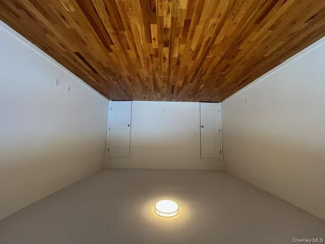 Bedroom featuring wood-style floors and baseboards Bedroom featuring wood-style floors and baseboards