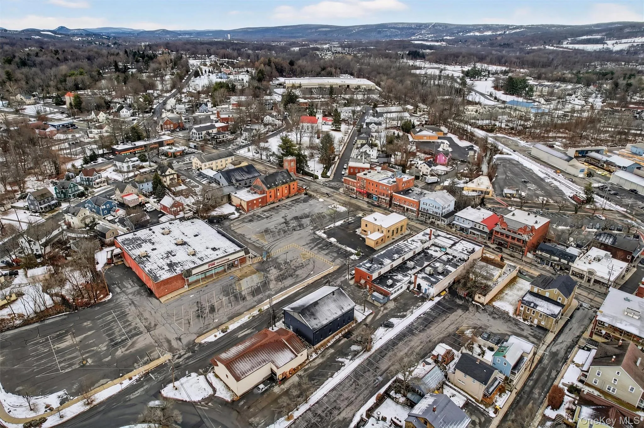 Snowy aerial view with a mountain view Snowy aerial view with a mountain view