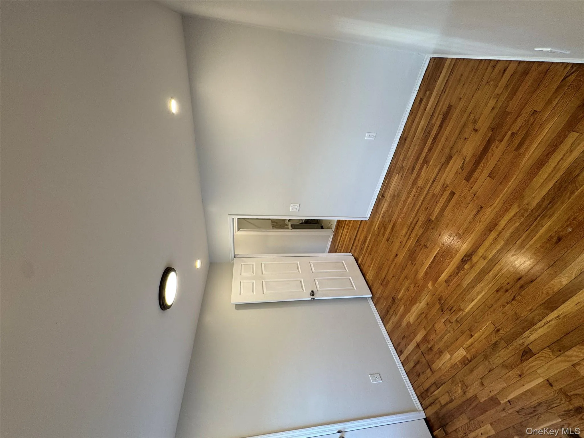 Spare room with hardwood / wood-style flooring and recessed lighting Spare room with hardwood / wood-style flooring and recessed lighting