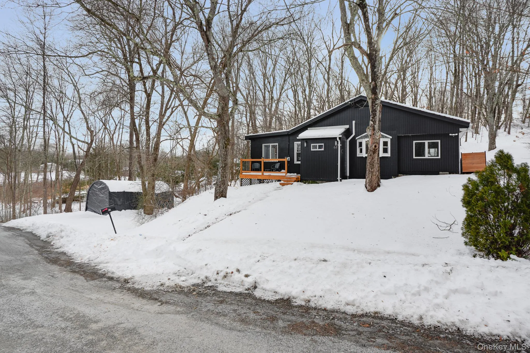 Snow covered property with a deck Snow covered property with a deck