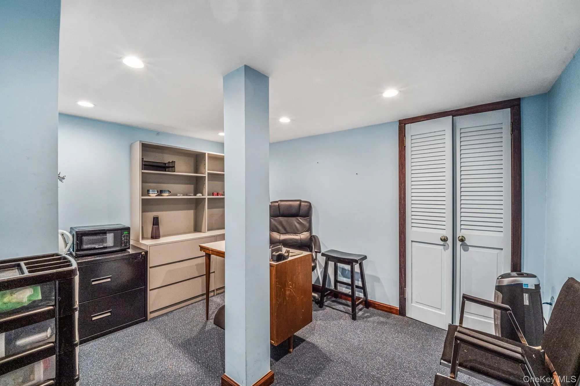 Home office featuring dark colored carpet and recessed lighting Home office featuring dark colored carpet and recessed lighting