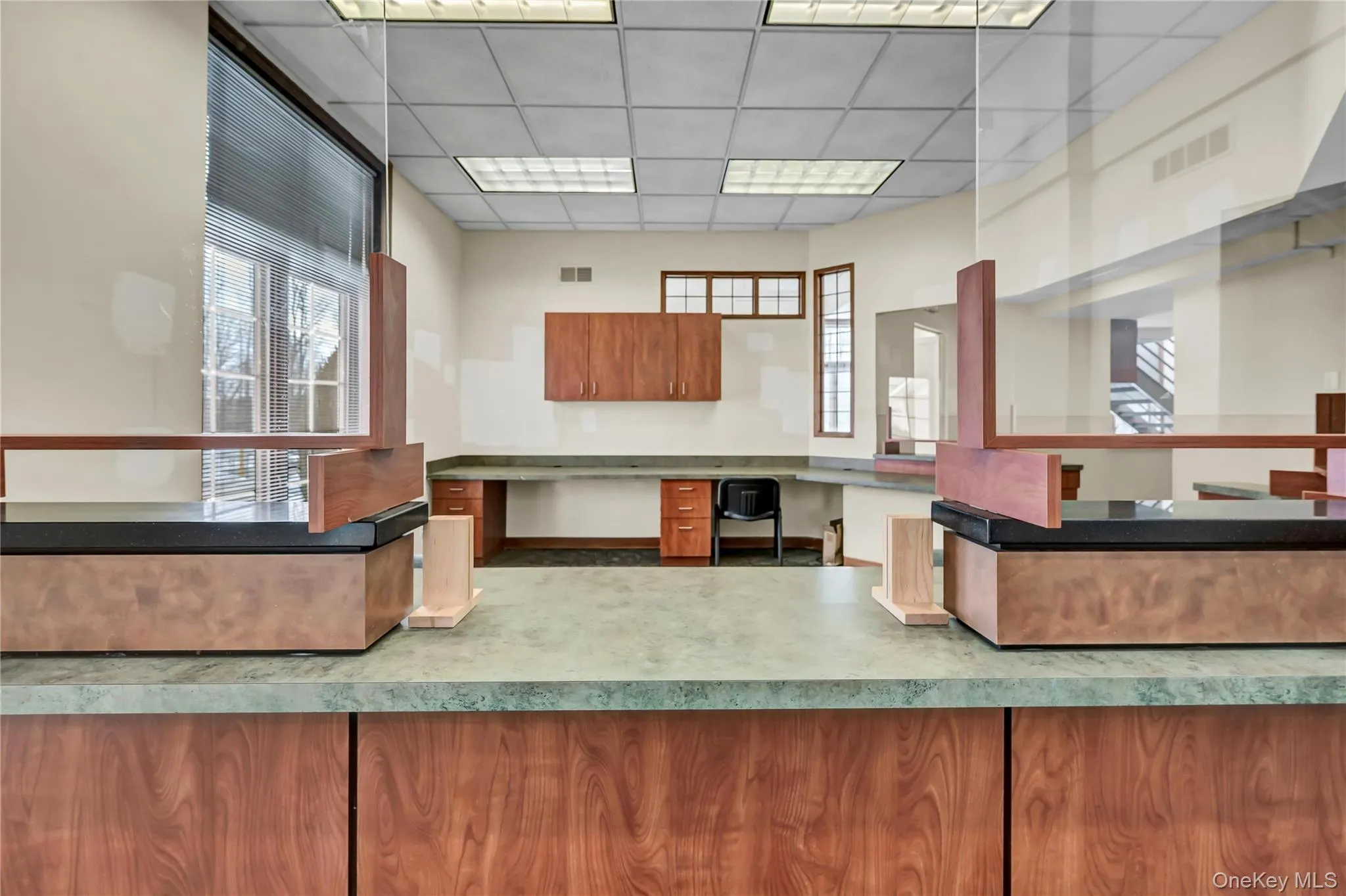 Reception with built in study area and a paneled ceiling Reception with built in study area and a paneled ceiling
