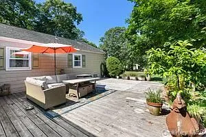 Wooden deck with an outdoor living space Wooden deck with an outdoor living space