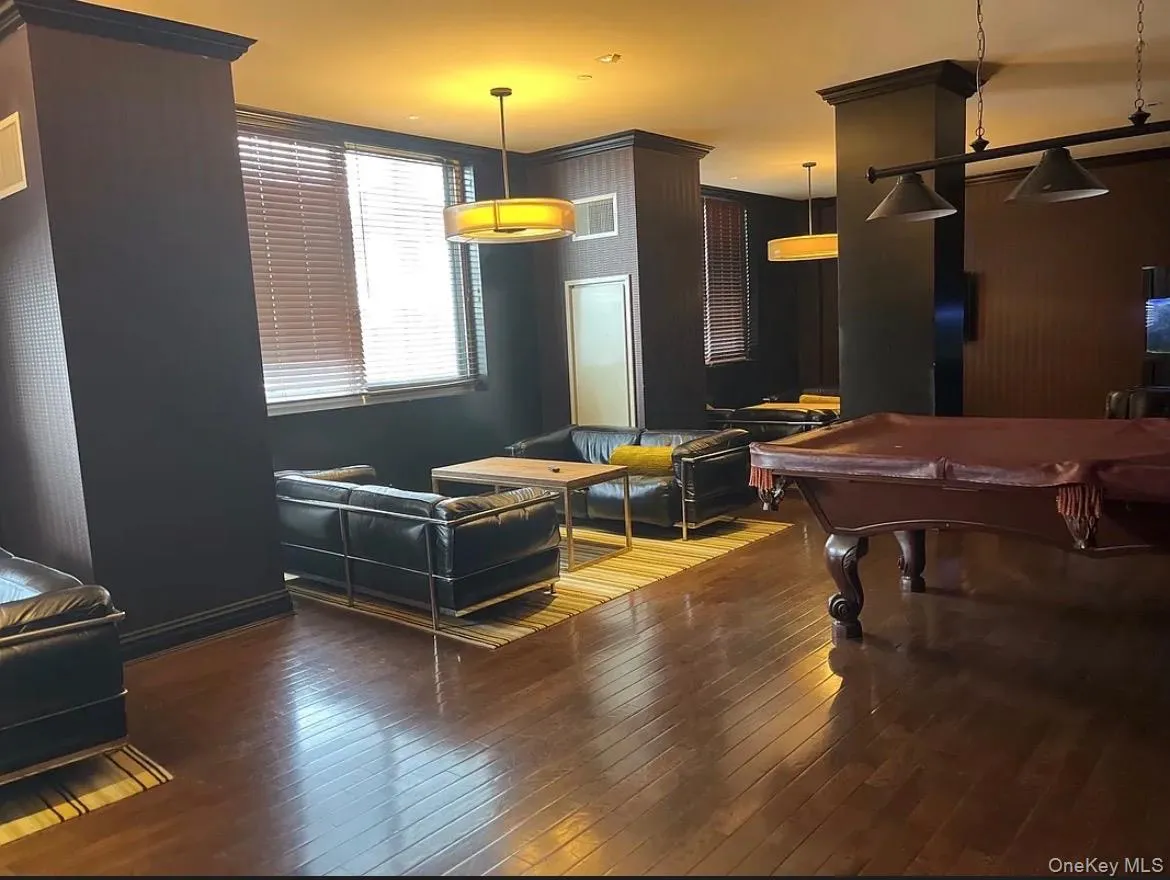 Rec room featuring pool table and hardwood / wood-style floors Rec room featuring pool table and hardwood / wood-style floors