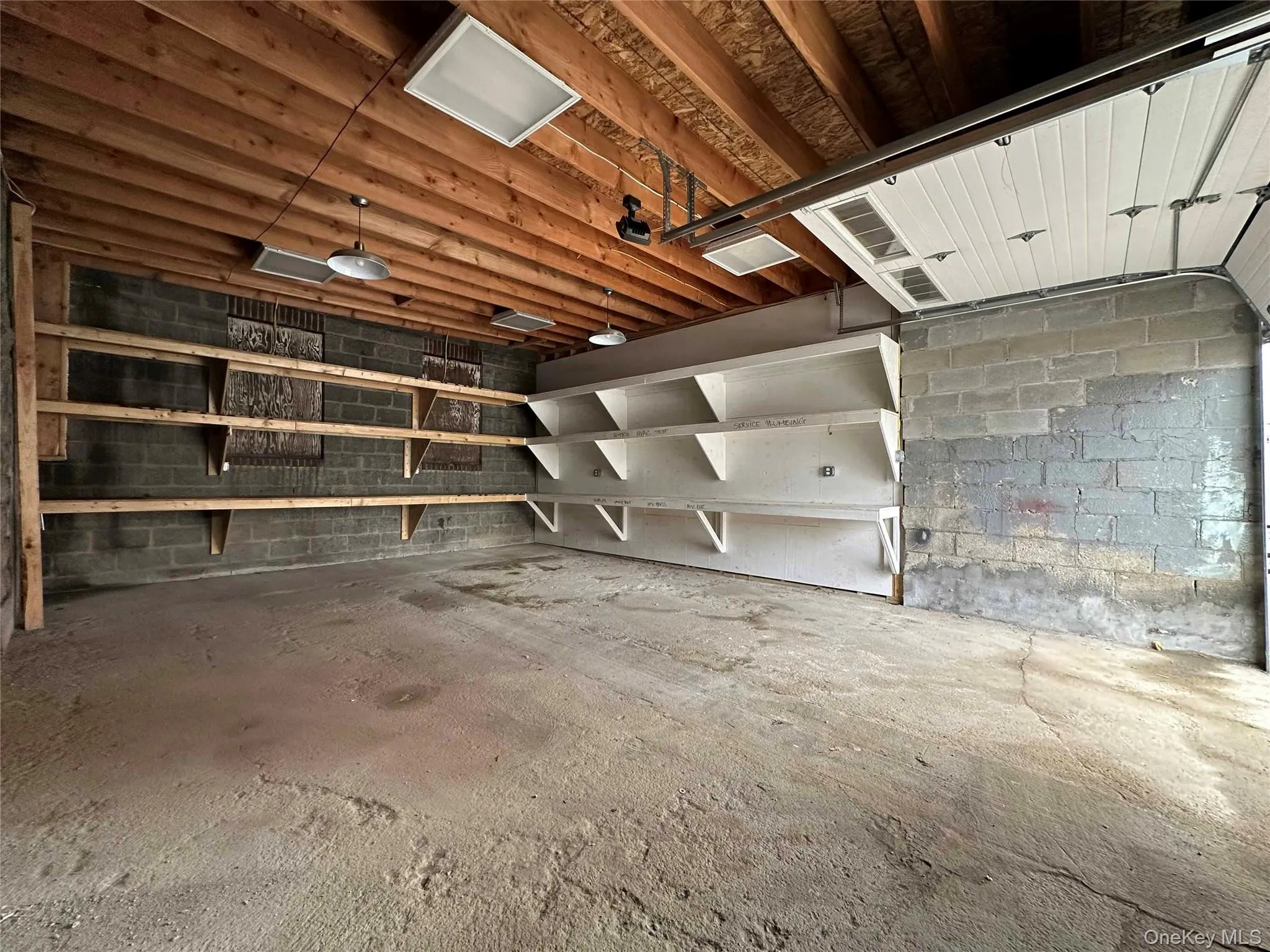 Garage featuring concrete block wall Garage featuring concrete block wall