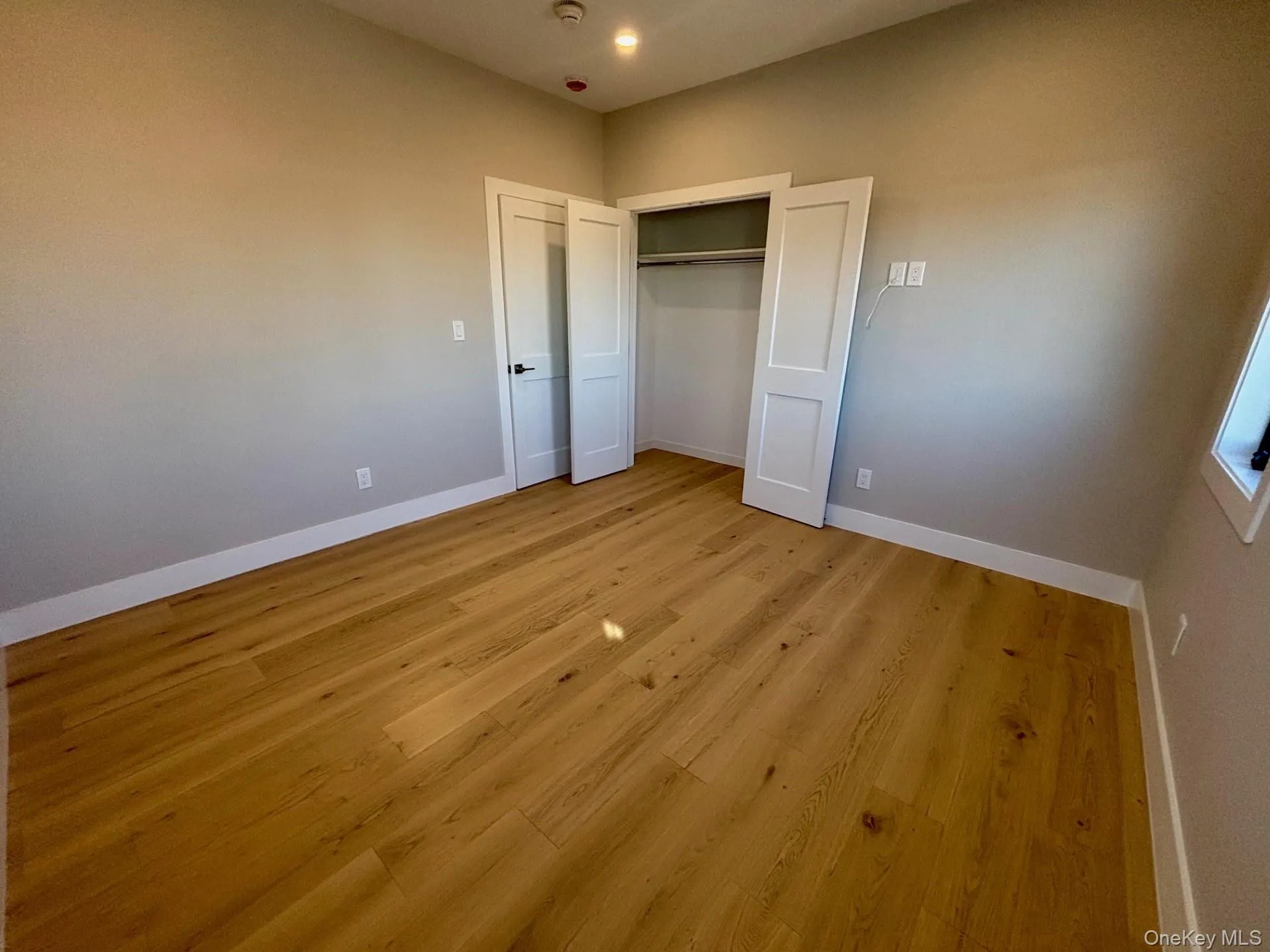 Unfurnished bedroom featuring light wood-style floors, a closet, and recessed lighting Unfurnished bedroom featuring light wood-style floors, a closet, and recessed lighting