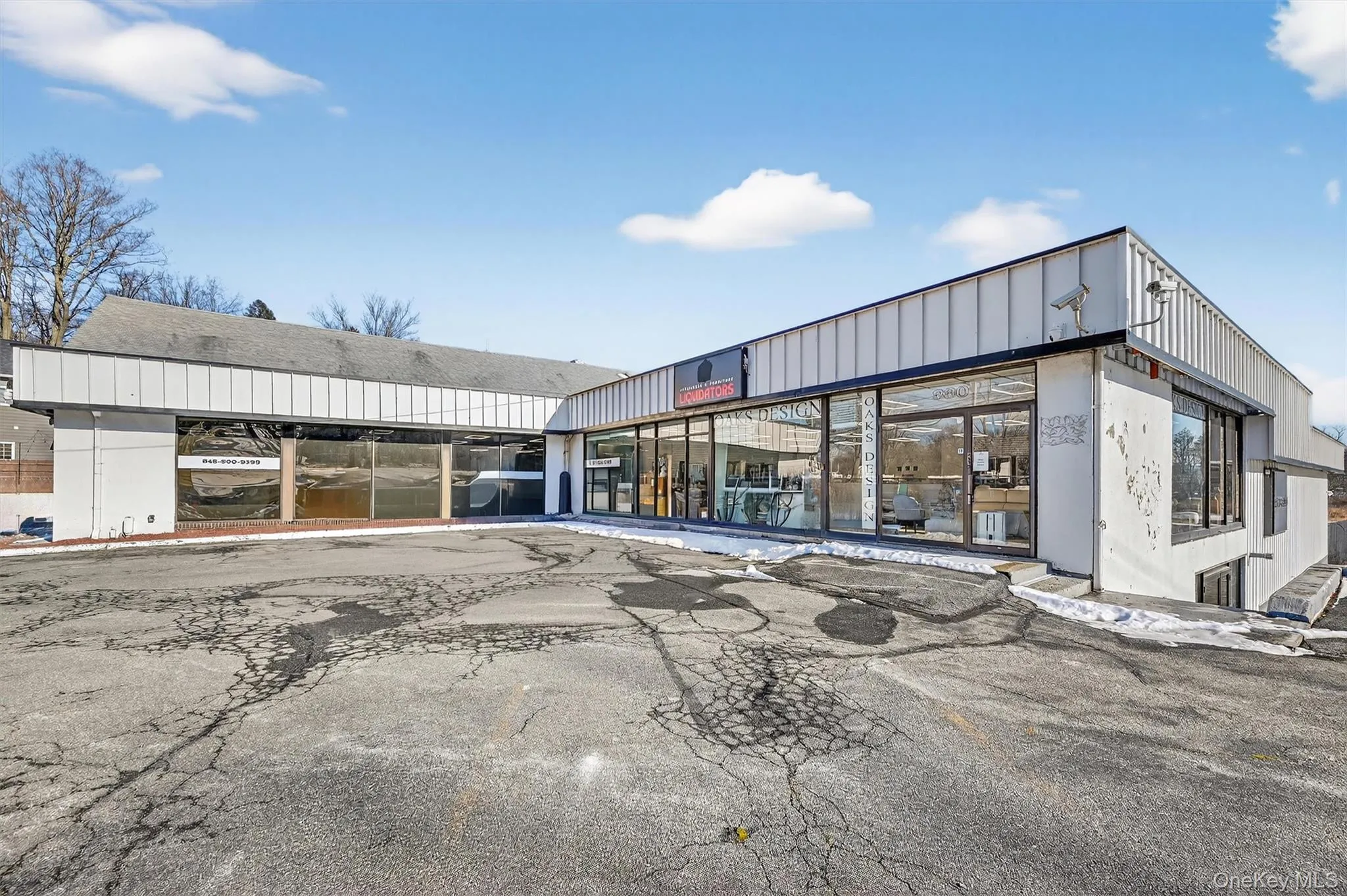 View of commercial location featuring uncovered parking View of commercial location featuring uncovered parking