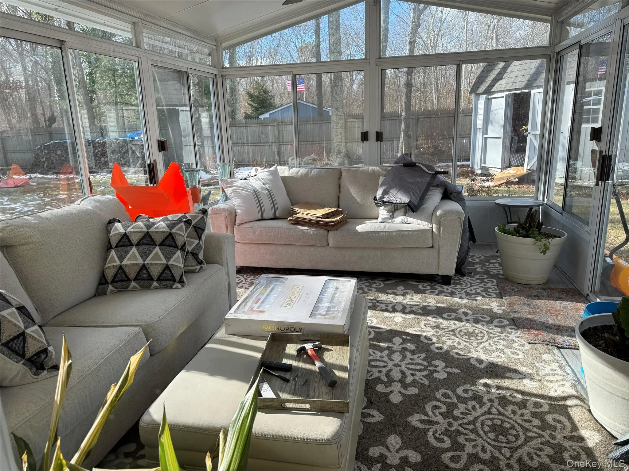 Sunroom / solarium with outdoor lounge area, lofted ceiling, and plenty of natural light Sunroom / solarium with outdoor lounge area, lofted ceiling, and plenty of natural light