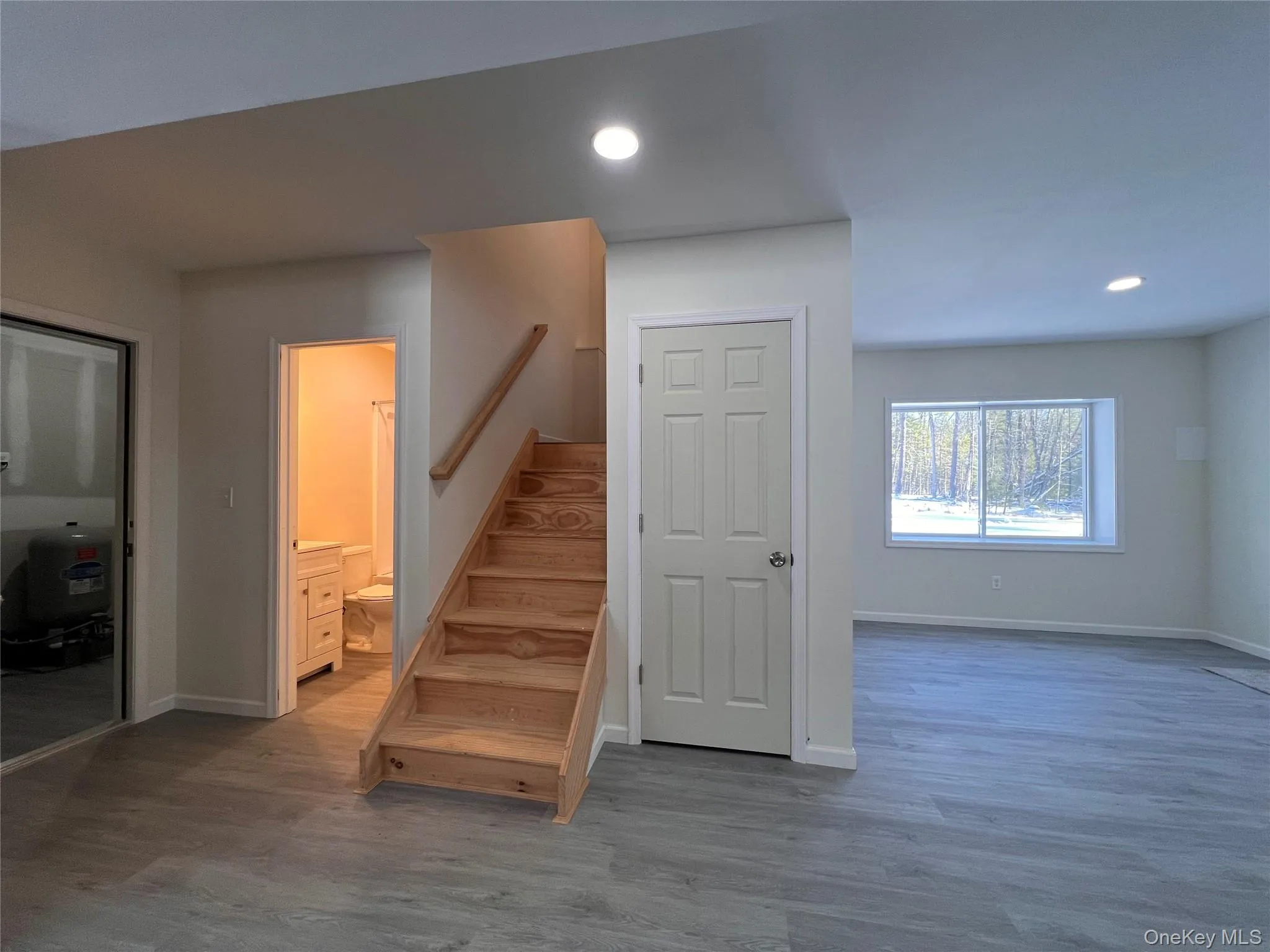 Stairway featuring wood finished floors and recessed lighting Stairway featuring wood finished floors and recessed lighting