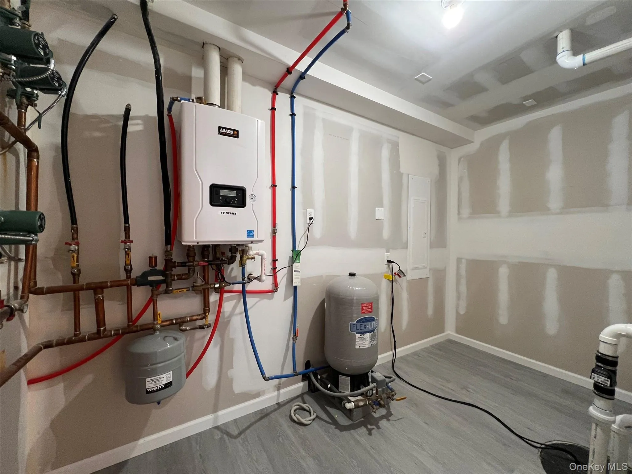 Utility room with tankless water heater Utility room with tankless water heater