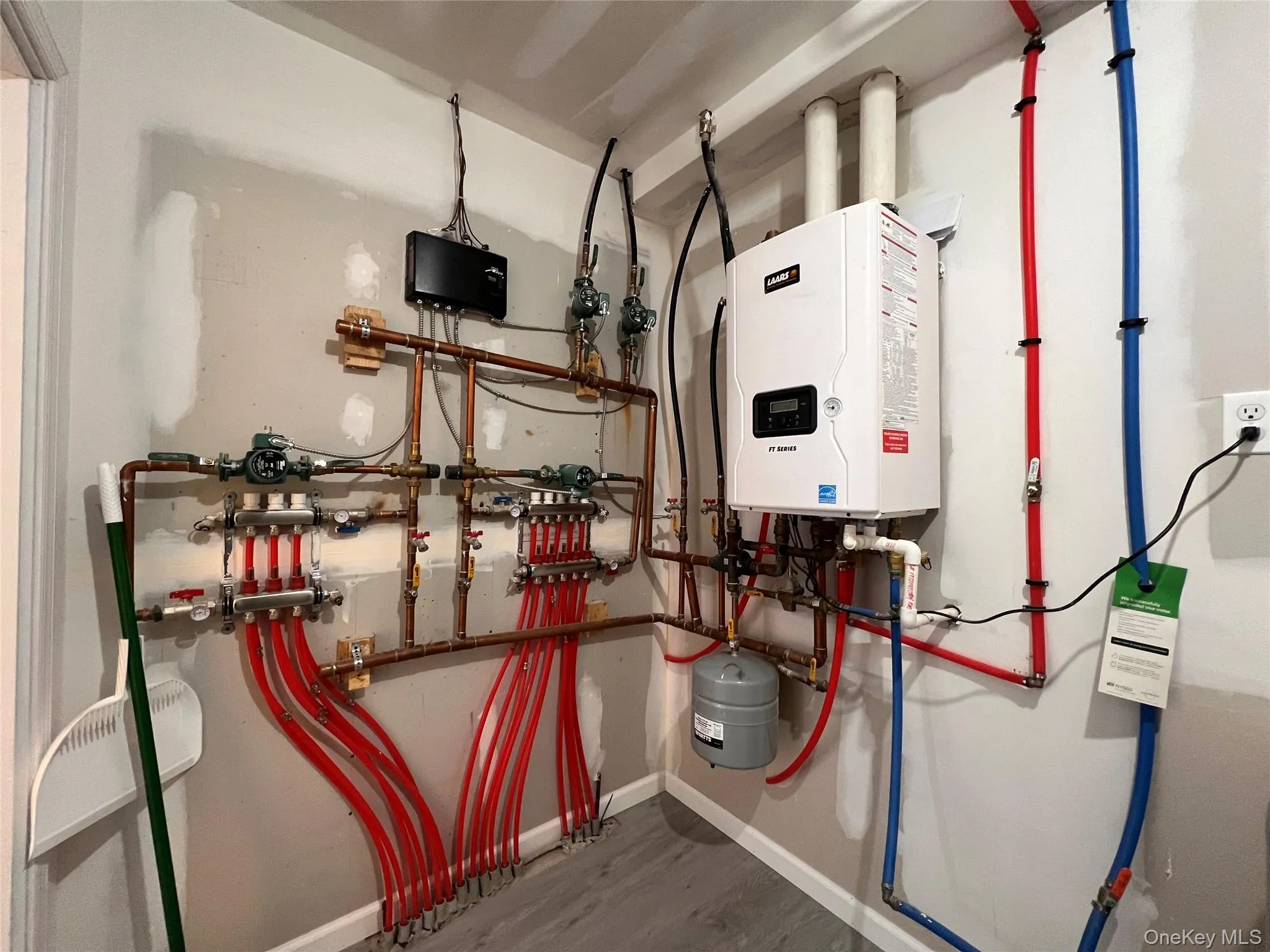 Utility room with tankless water heater Utility room with tankless water heater