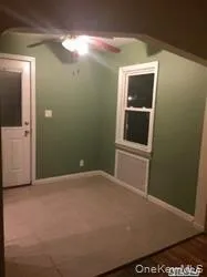 Empty room featuring a ceiling fan and baseboards Empty room featuring a ceiling fan and baseboards