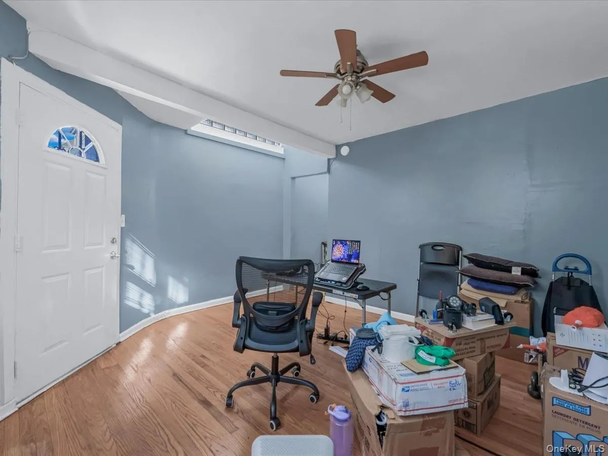 Home office with wood finished floors and ceiling fan Home office with wood finished floors and ceiling fan