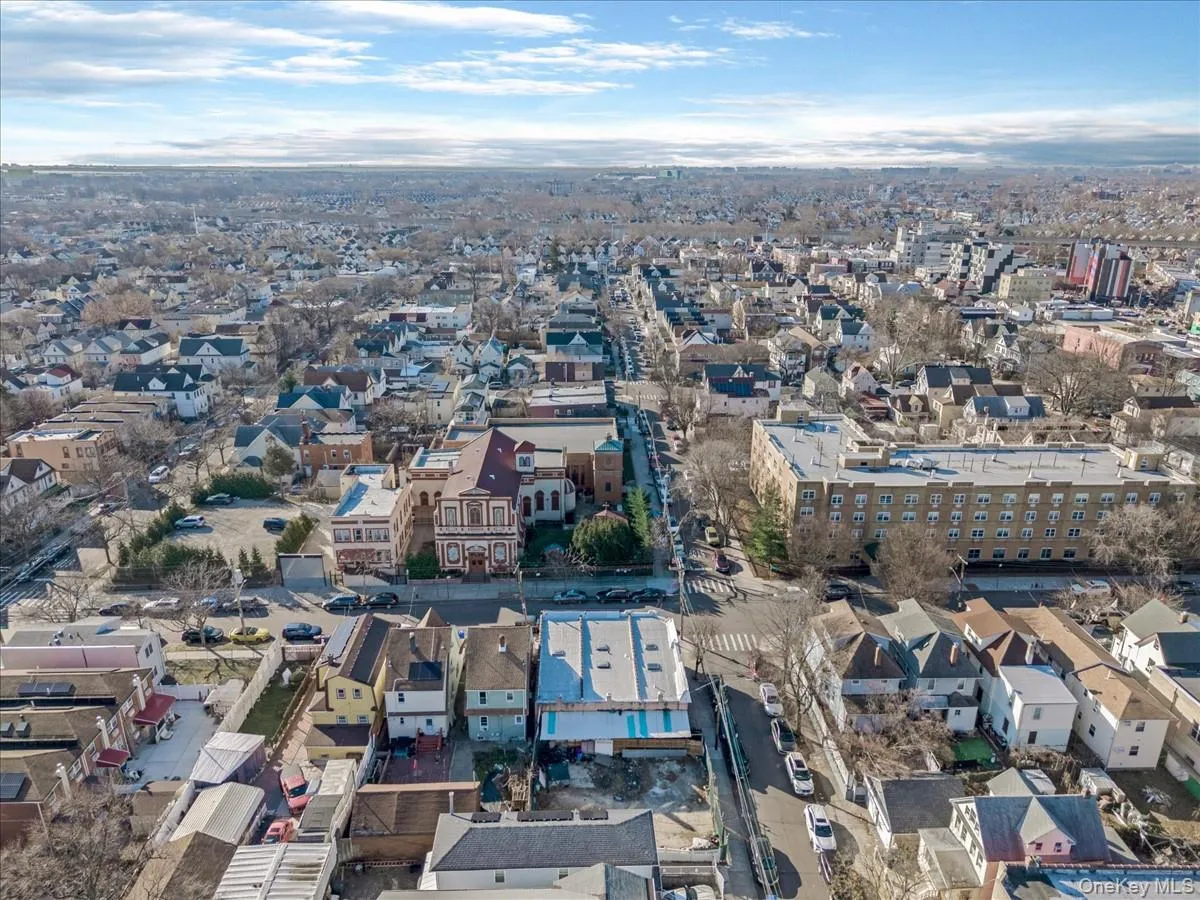 Aerial view of property's location with nearby urban area Aerial view of property's location with nearby urban area