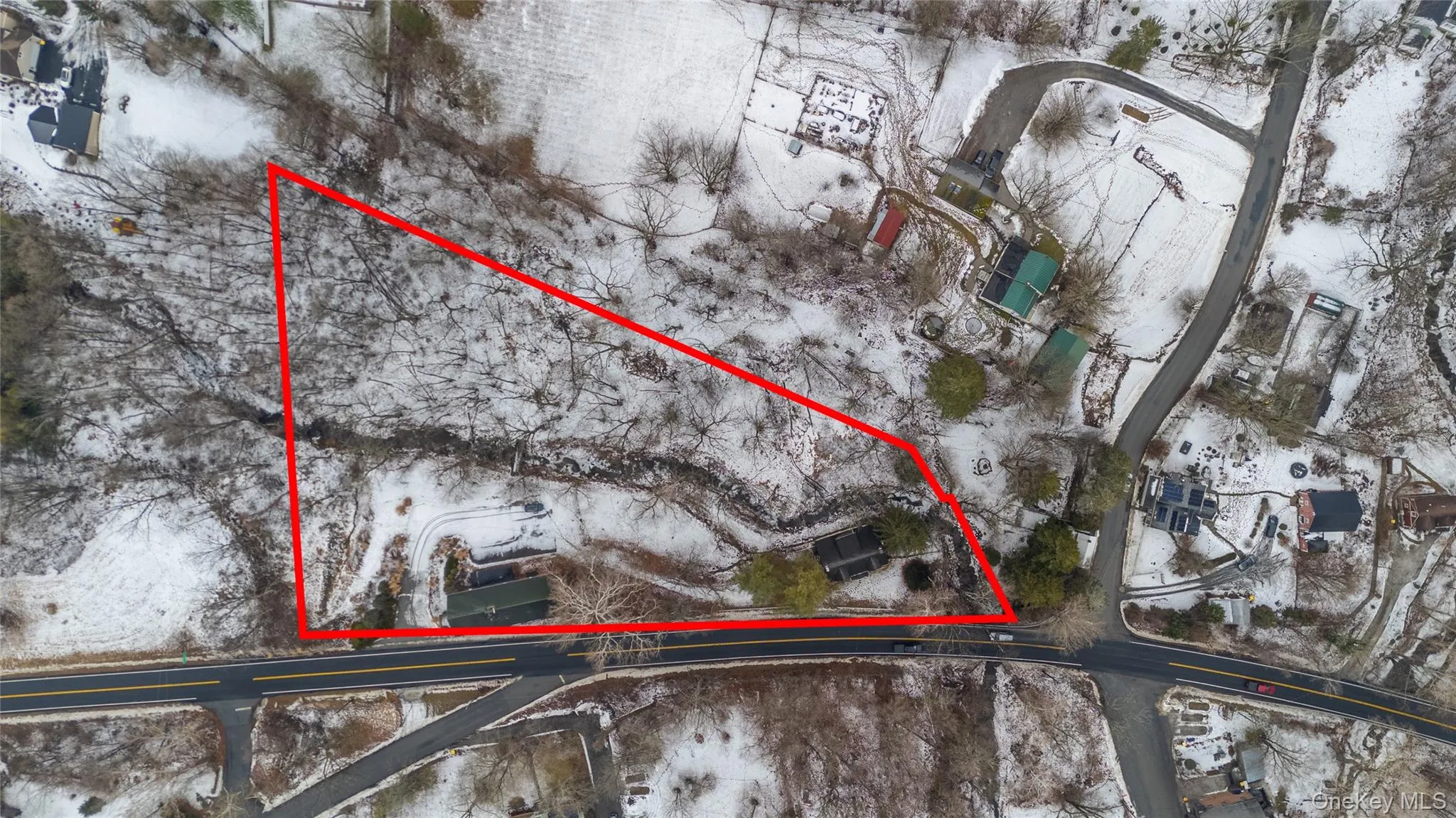 Snowy aerial view featuring property parcel outlined Snowy aerial view featuring property parcel outlined