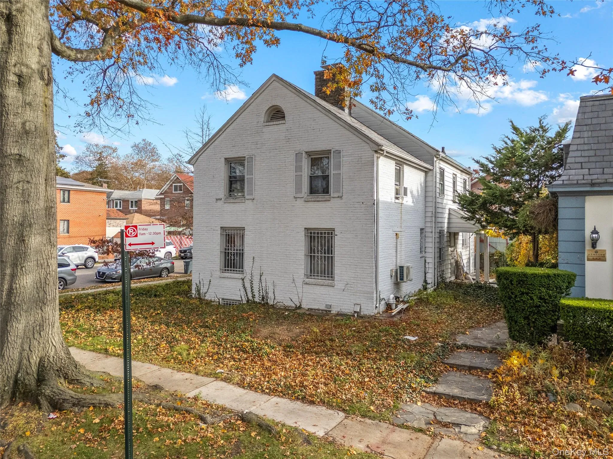 View of home's exterior with a chimney and brick siding View of home's exterior with a chimney and brick siding