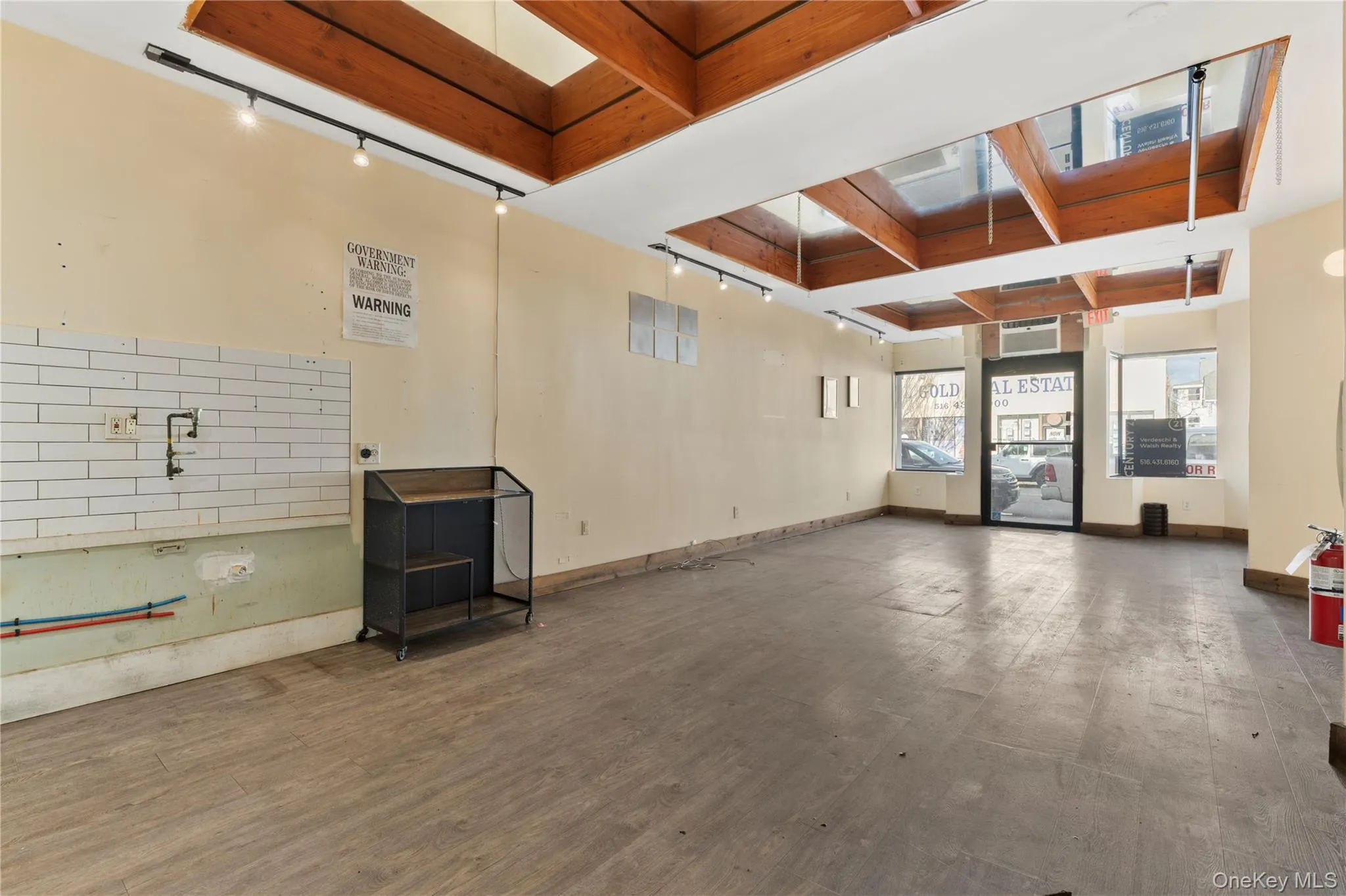 Misc room featuring beamed ceiling and coffered ceiling Misc room featuring beamed ceiling and coffered ceiling