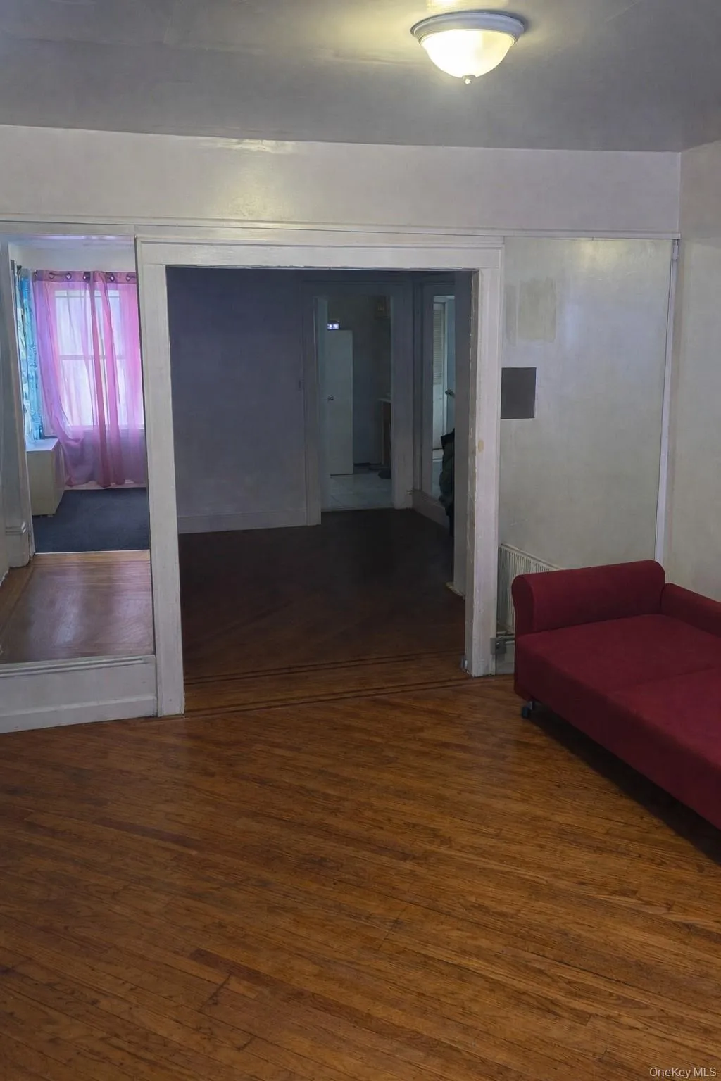 Corridor featuring dark wood-style flooring Corridor featuring dark wood-style flooring