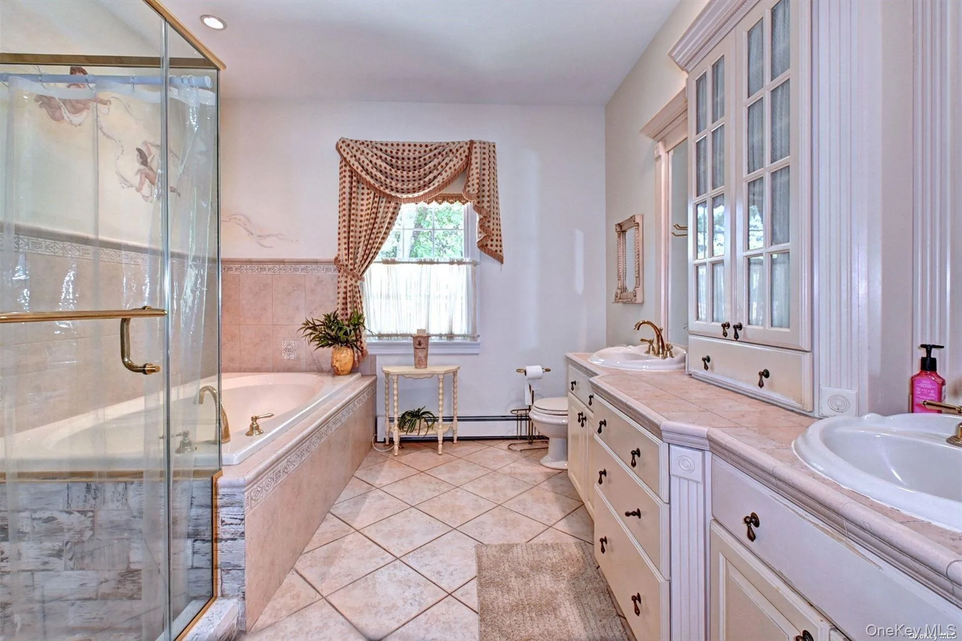 Primary Bath Featuring Custom Tile & Double Vanities Primary Bath Featuring Custom Tile & Double Vanities