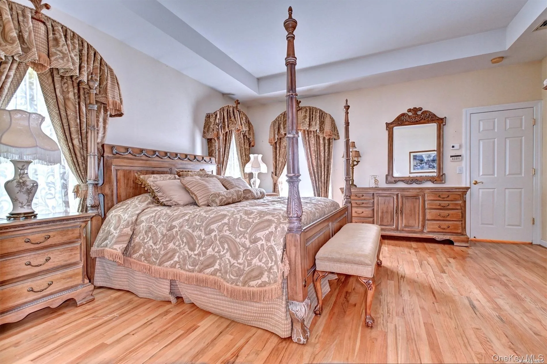 Primary Bedroom has Beautiful Tray Ceiling, Hardwood Floors Primary Bedroom has Beautiful Tray Ceiling, Hardwood Floors