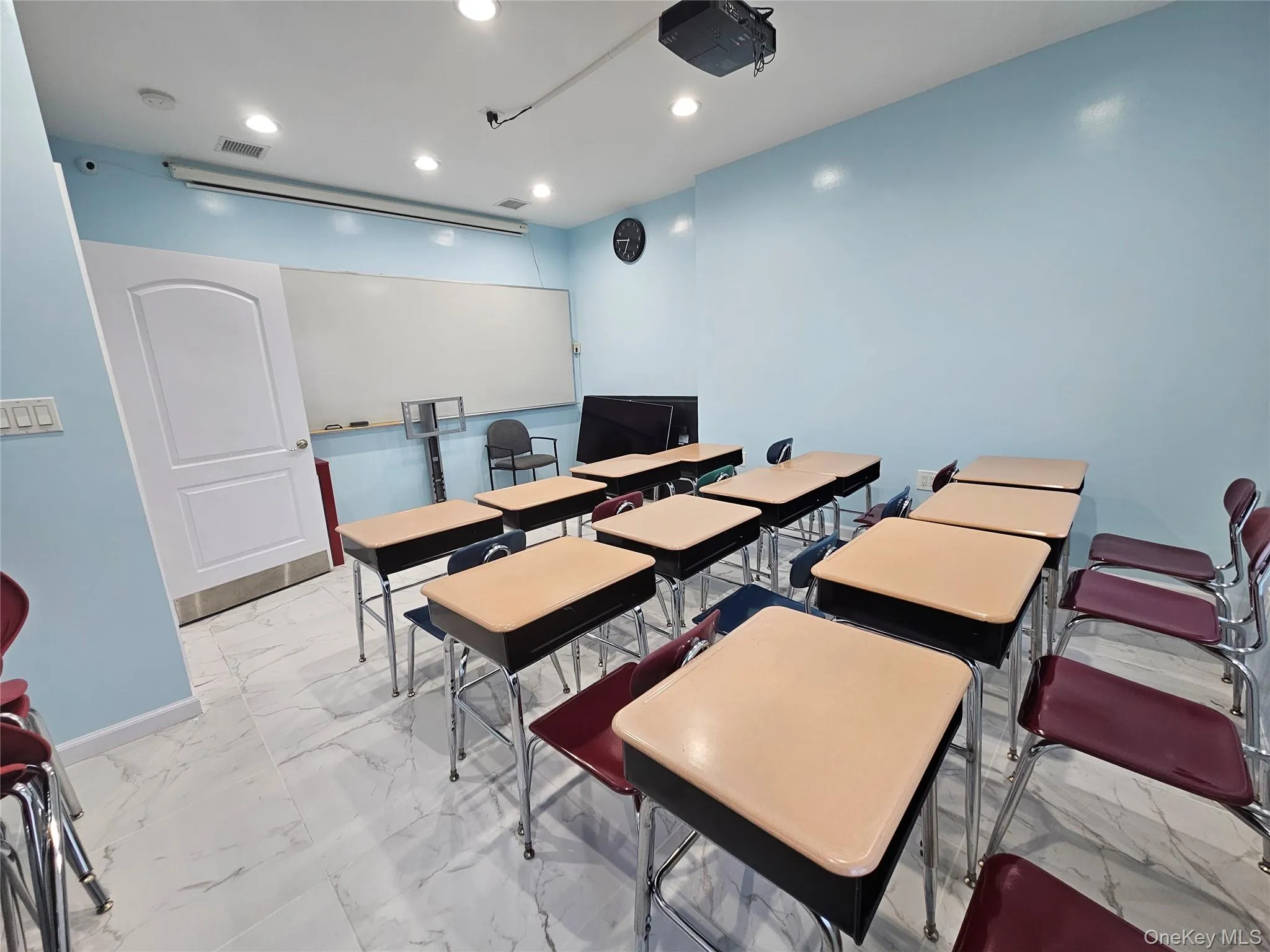 Dining area featuring light marble finish floors and recessed lighting Dining area featuring light marble finish floors and recessed lighting