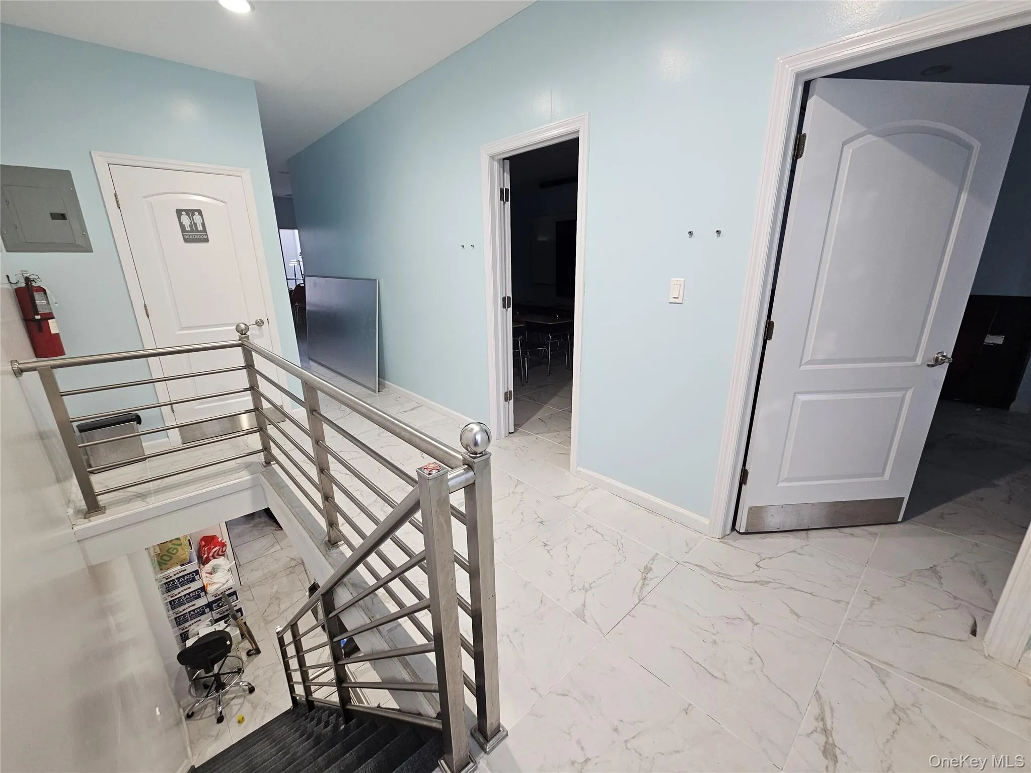Stairway with marble finish flooring and electric panel Stairway with marble finish flooring and electric panel