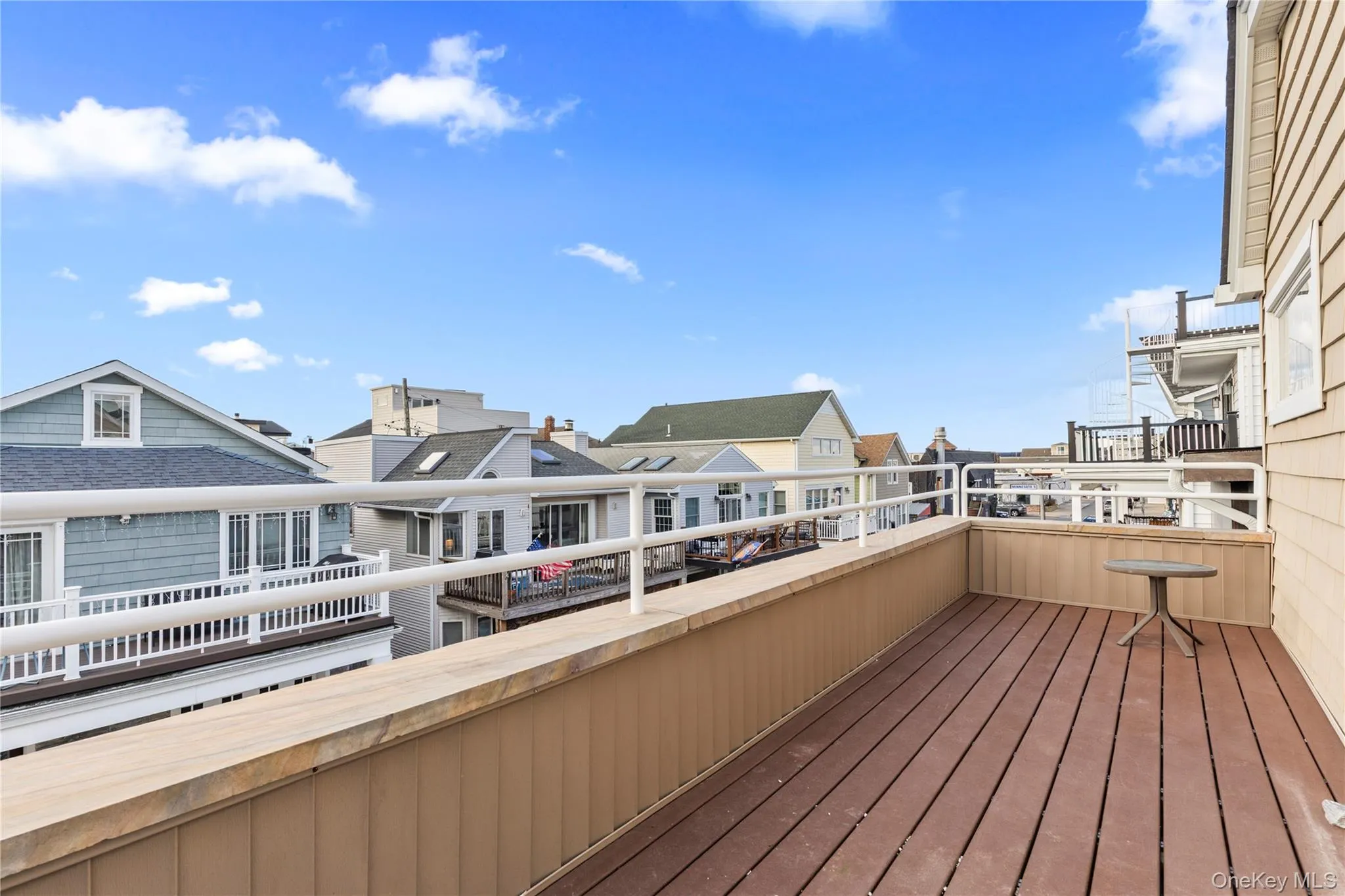 Wooden deck featuring a residential view Wooden deck featuring a residential view