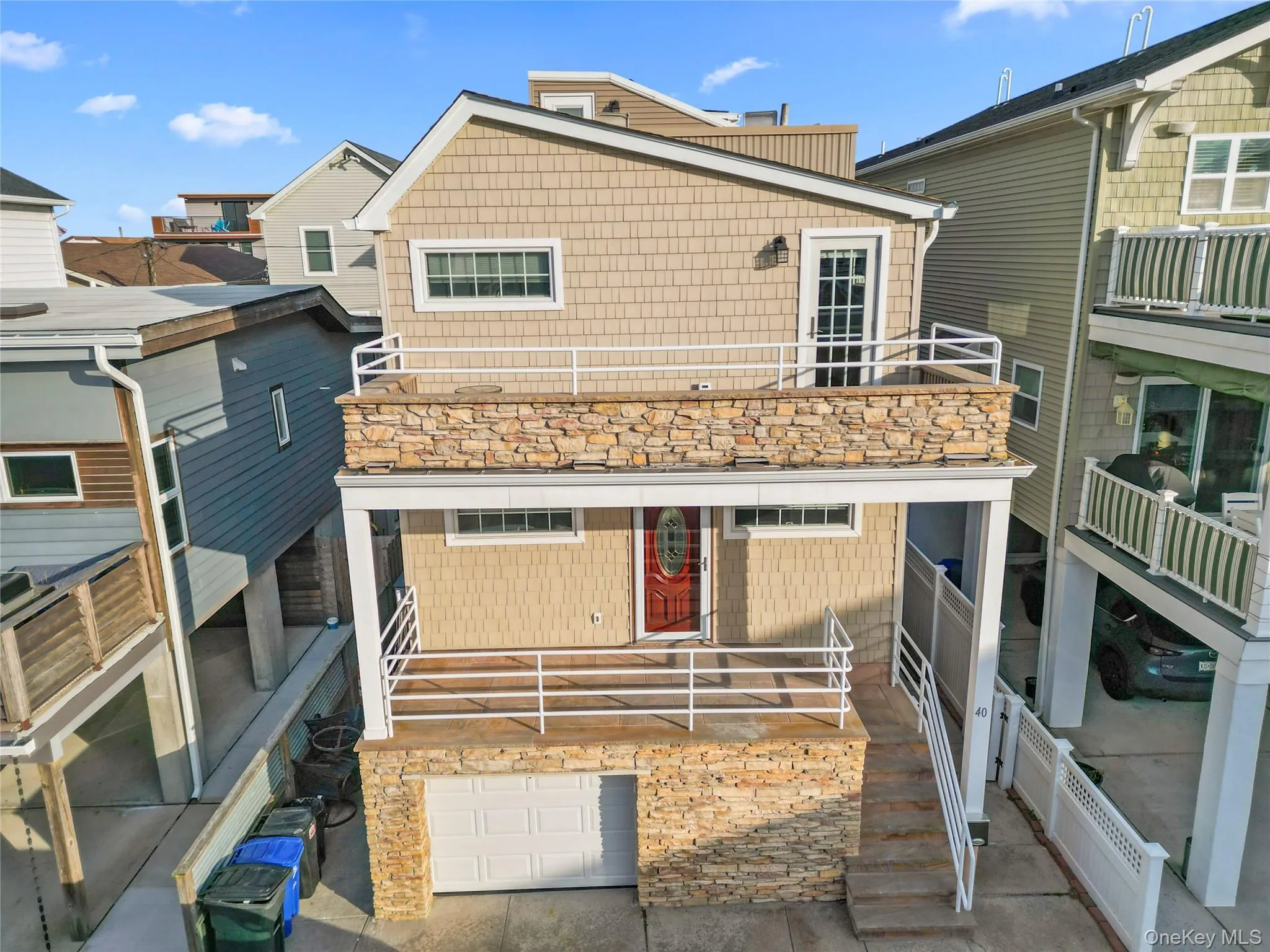 Rear view of house with a residential view and an attached garage Rear view of house with a residential view and an attached garage