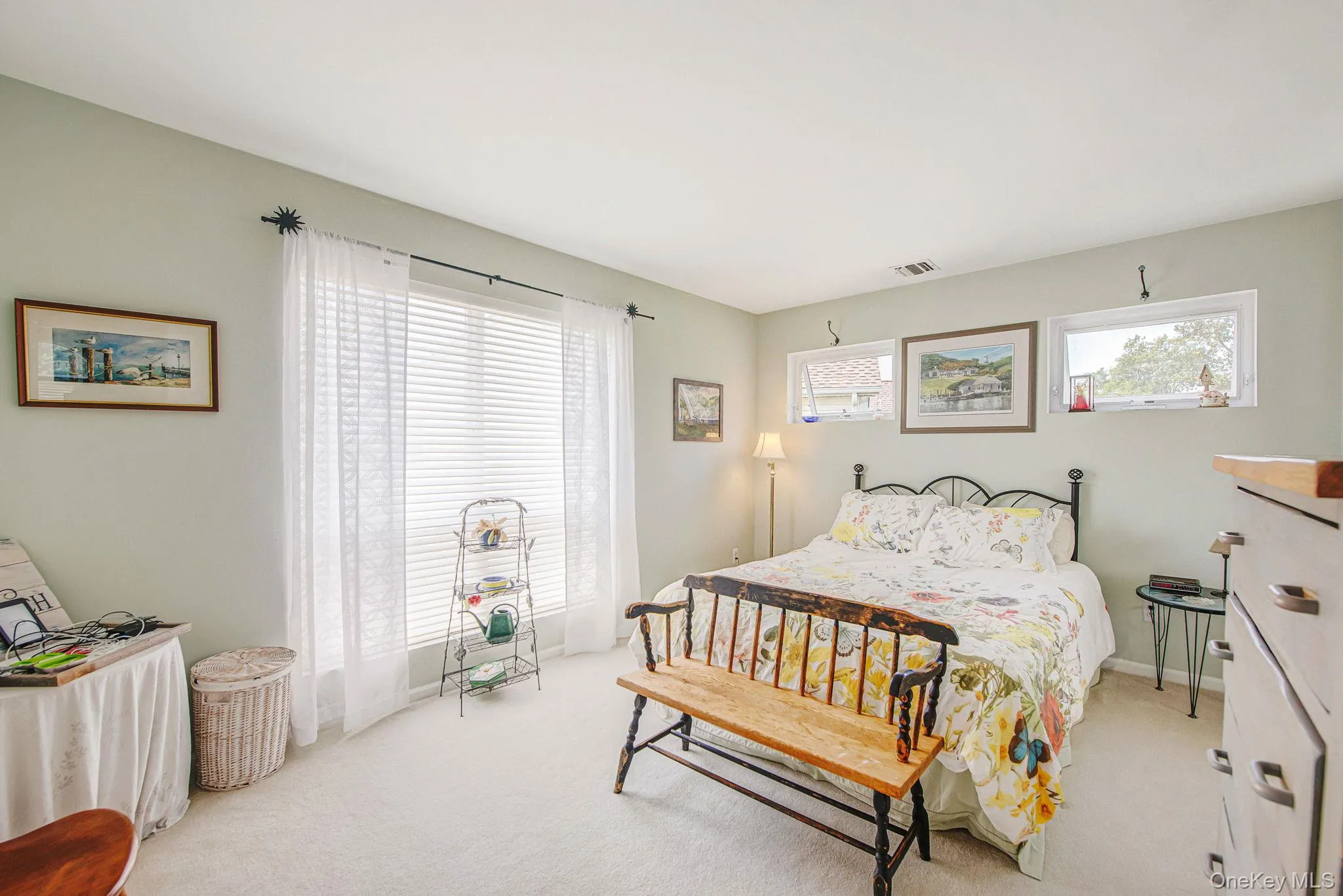 Bedroom featuring light colored carpet Bedroom featuring light colored carpet