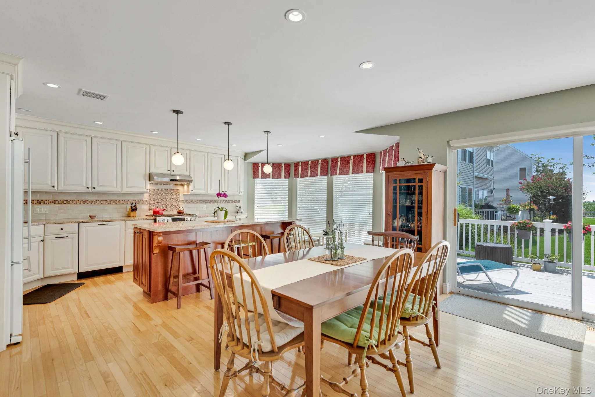 Dining area featuring light wood-style floors, healthy amount of natural light, and recessed lighting Dining area featuring light wood-style floors, healthy amount of natural light, and recessed lighting