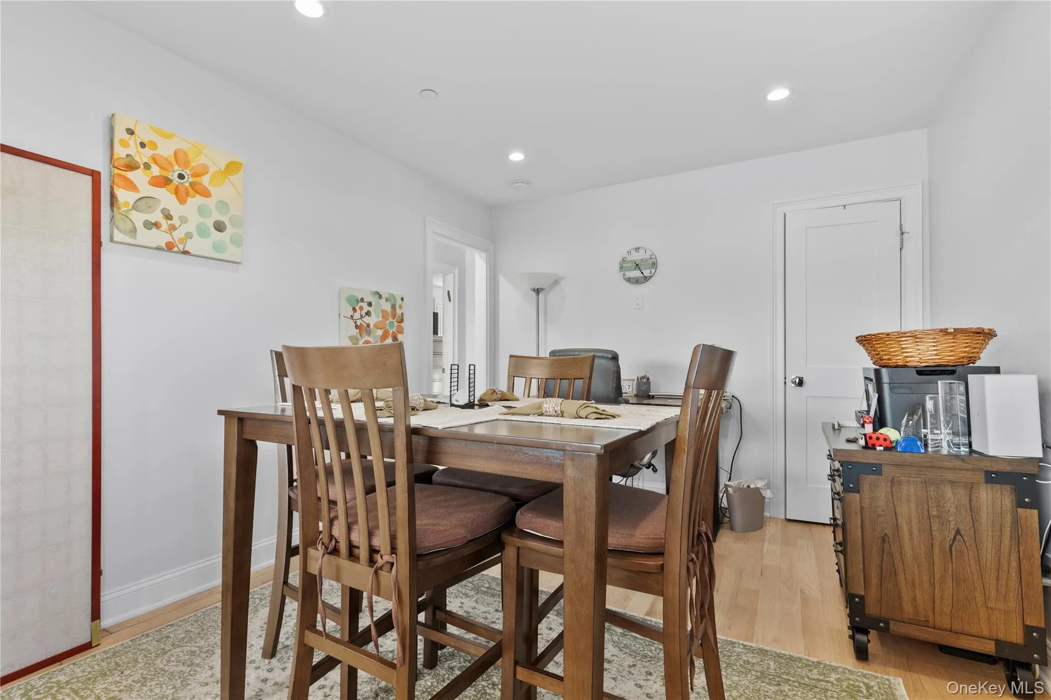 Dining space with light wood-type flooring and recessed lighting Dining space with light wood-type flooring and recessed lighting