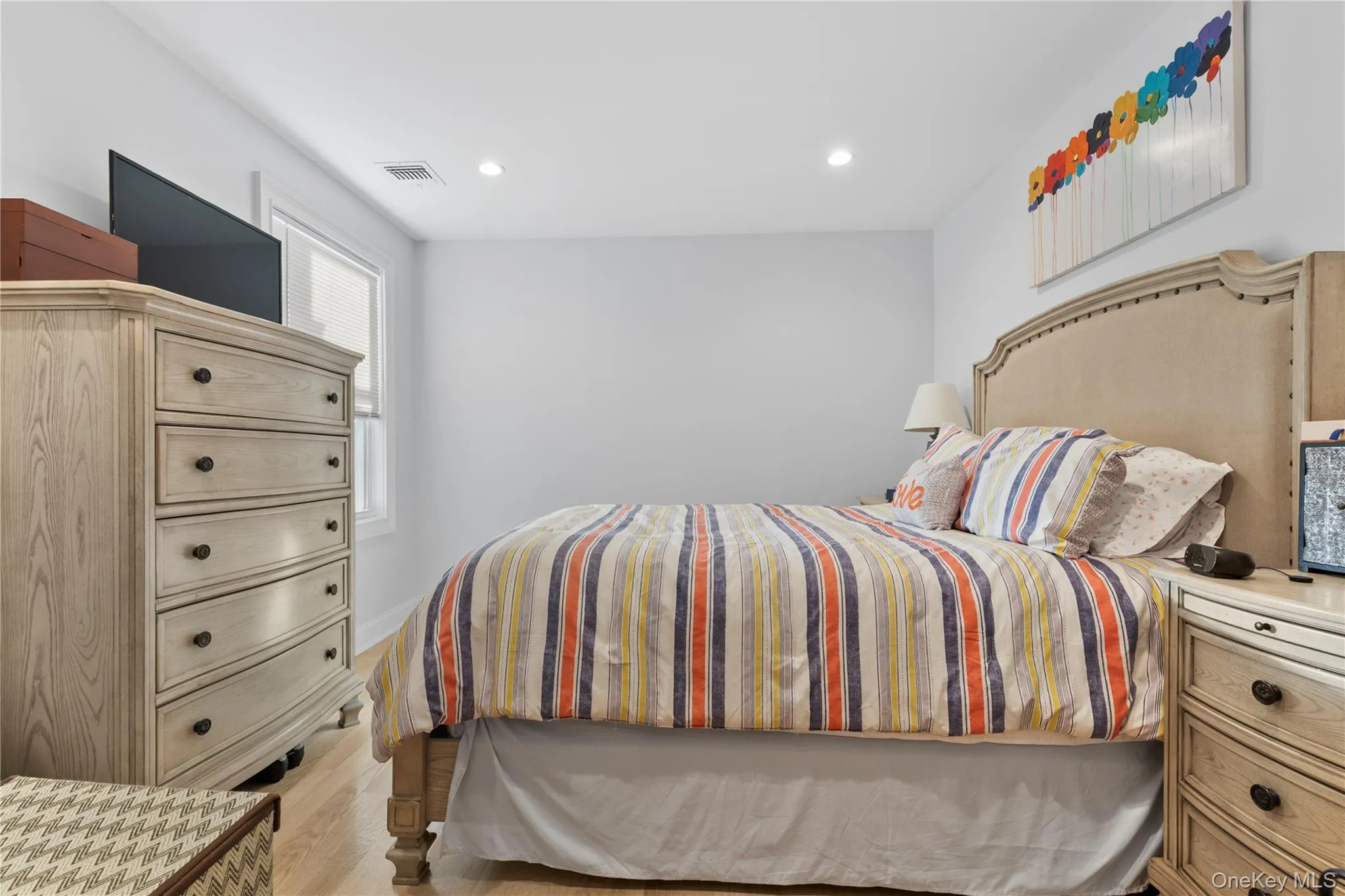 Bedroom featuring recessed lighting and light wood-style floors Bedroom featuring recessed lighting and light wood-style floors