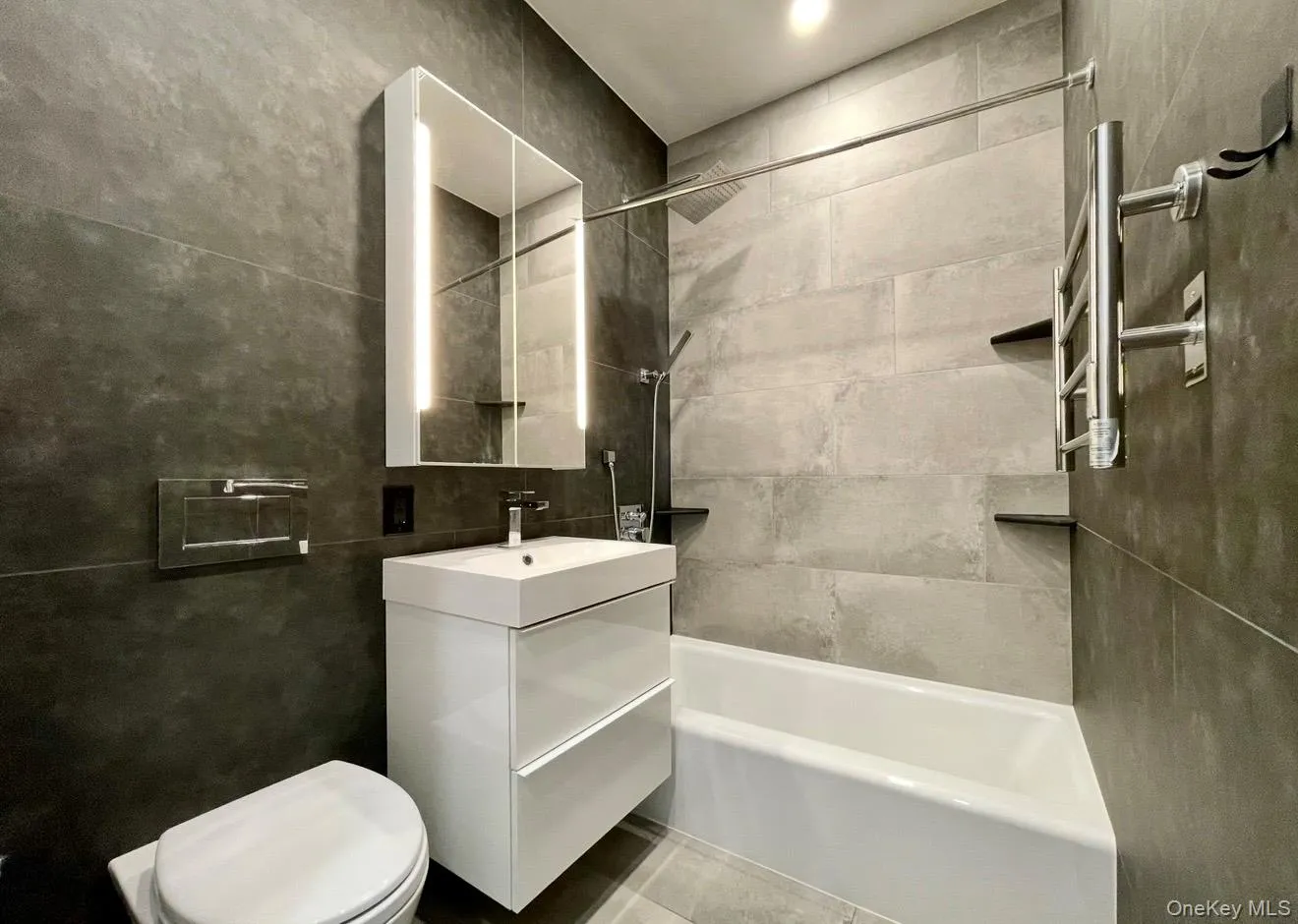 Full bath featuring vanity and shower combination Full bath featuring vanity and shower combination