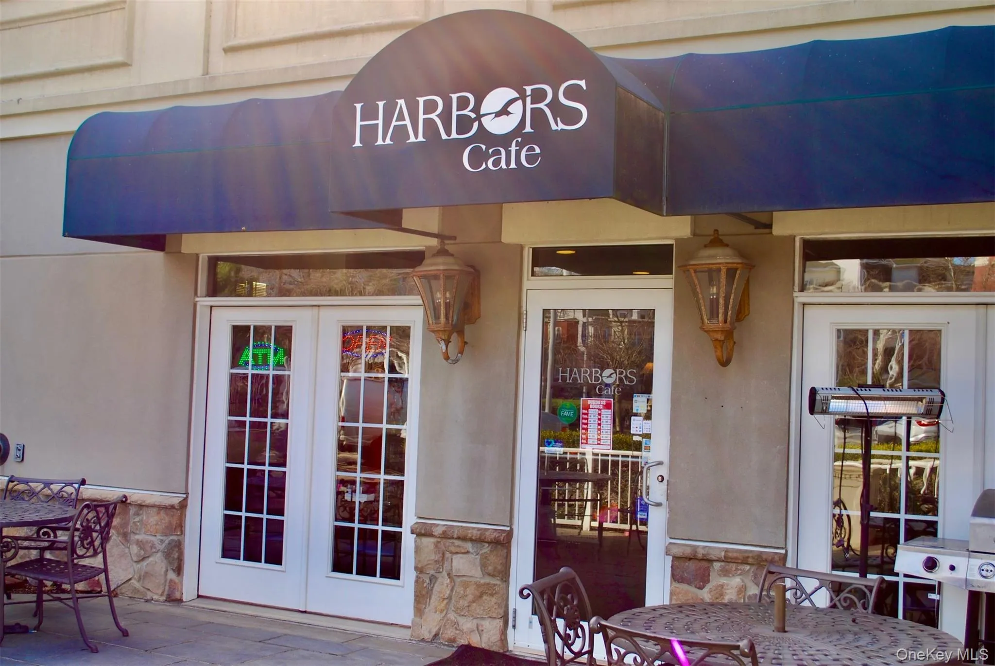 Property entrance featuring french doors and stone siding Property entrance featuring french doors and stone siding