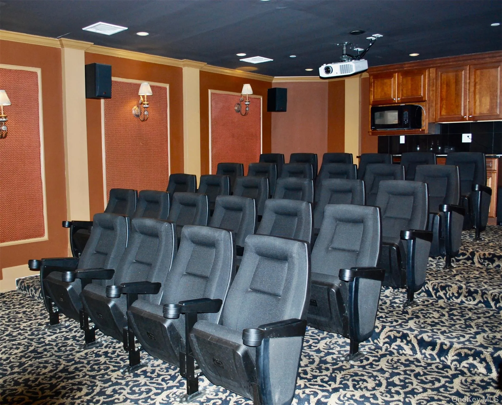 Carpeted cinema room featuring crown molding and recessed lighting Carpeted cinema room featuring crown molding and recessed lighting