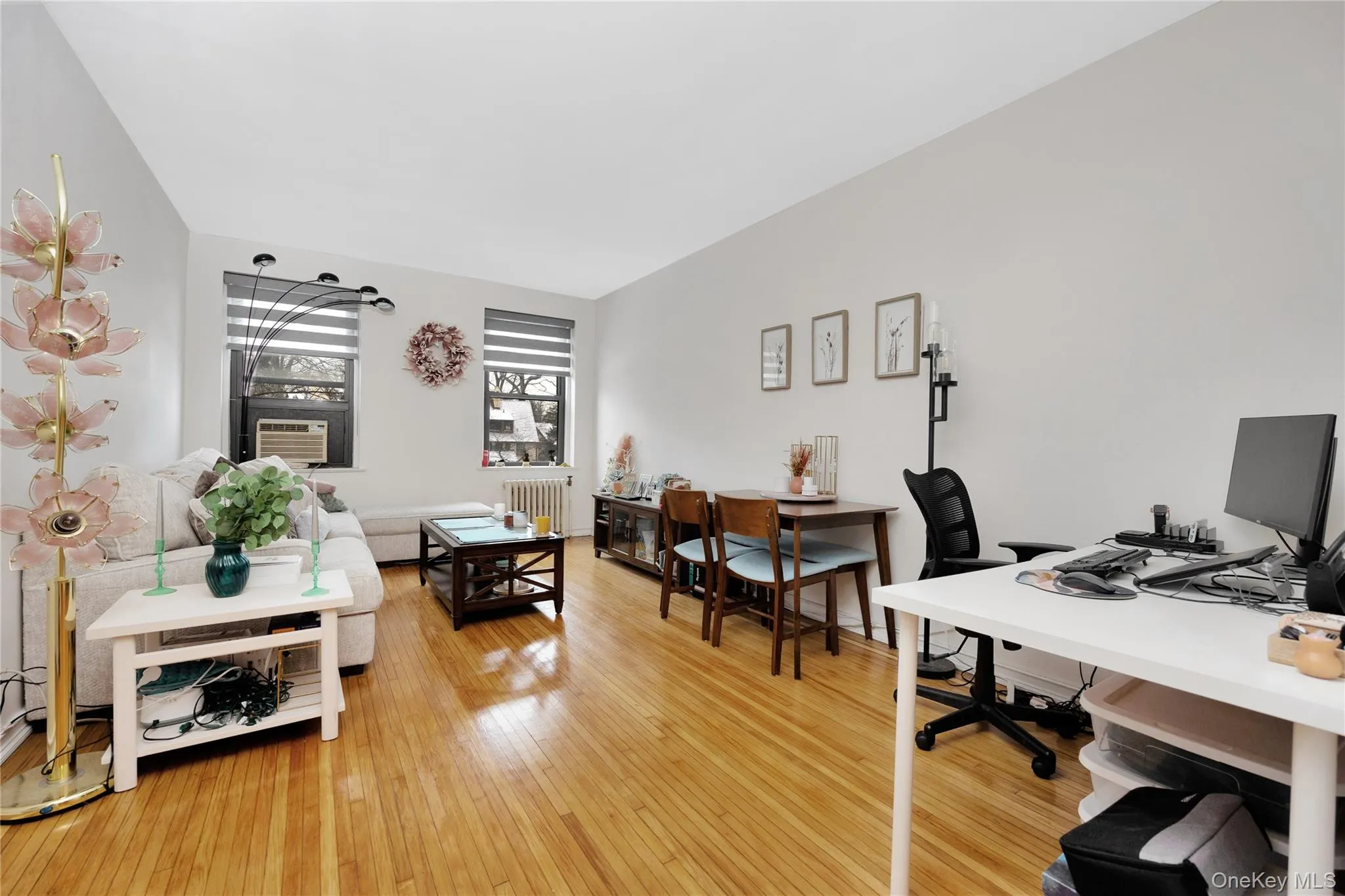 Office space with light wood-style floors and radiator Office space with light wood-style floors and radiator