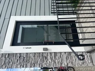 Entrance to property featuring stone siding Entrance to property featuring stone siding