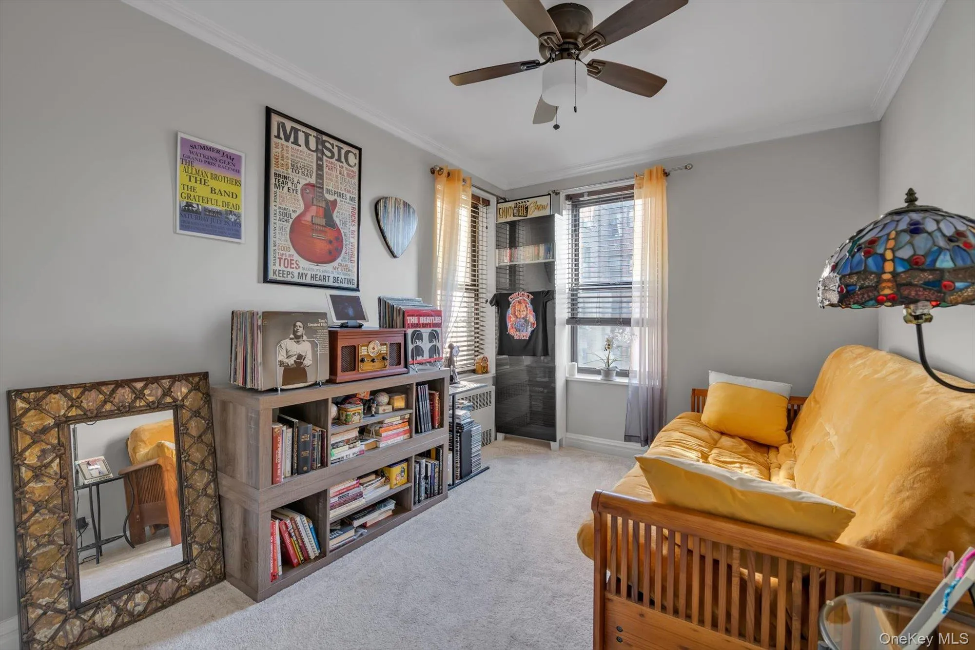 Sitting room featuring crown molding, light carpet, a ceiling fan, and radiator Sitting room featuring crown molding, light carpet, a ceiling fan, and radiator