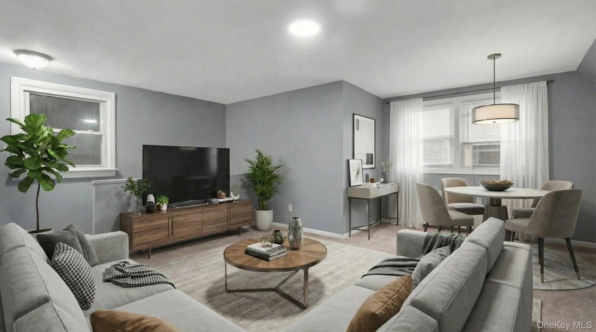 Living area featuring light carpet Living area featuring light carpet