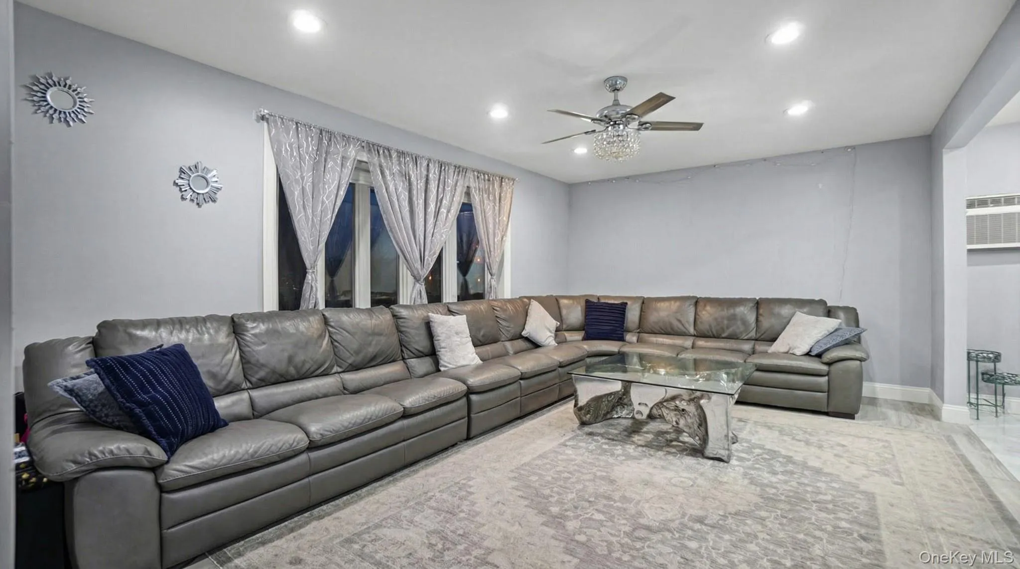 Living area with recessed lighting and ceiling fan Living area with recessed lighting and ceiling fan