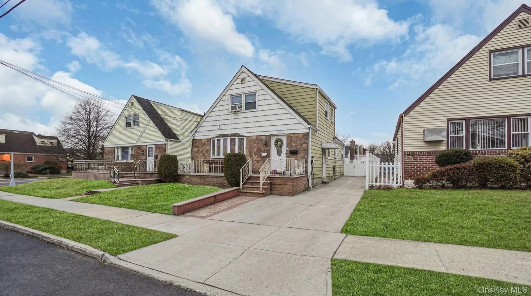 Bungalow-style house with a gate Bungalow-style house with a gate