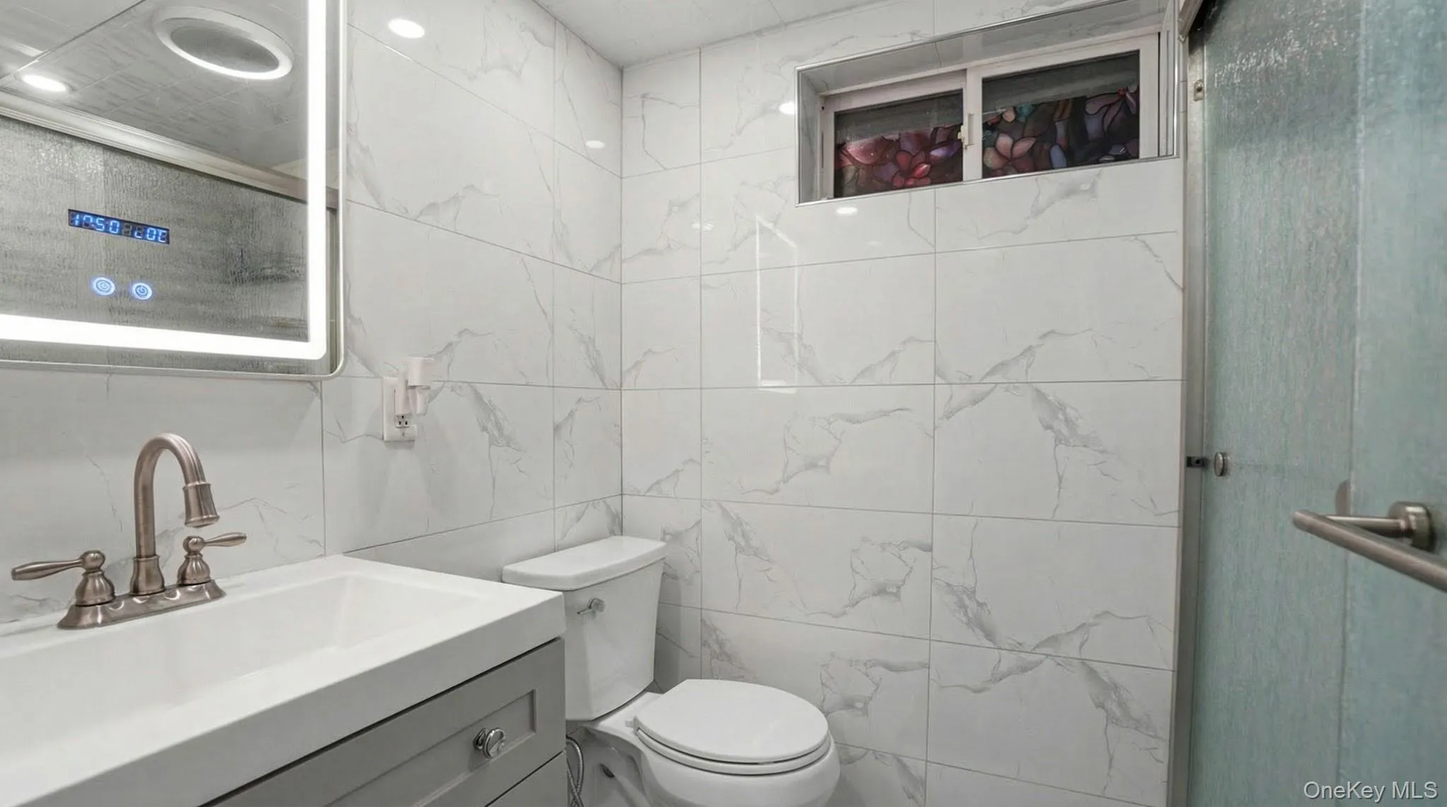 Bathroom with tile walls and vanity Bathroom with tile walls and vanity