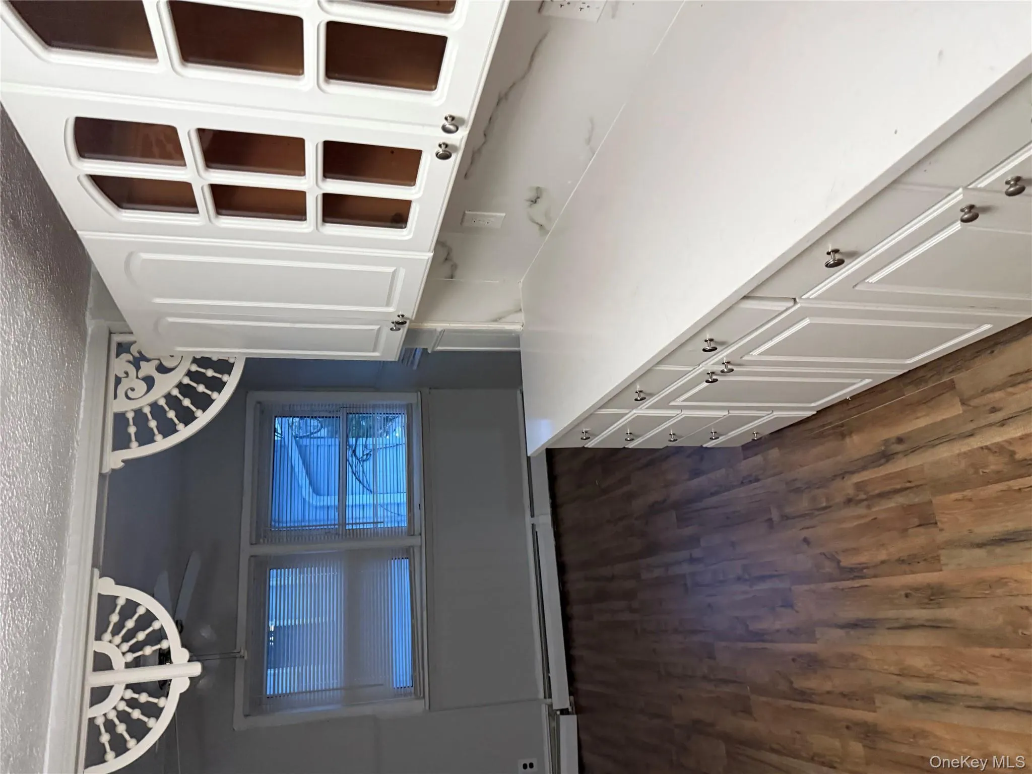 Unfurnished dining area with a textured ceiling, dark wood finished floors, and a baseboard heating unit Unfurnished dining area with a textured ceiling, dark wood finished floors, and a baseboard heating unit