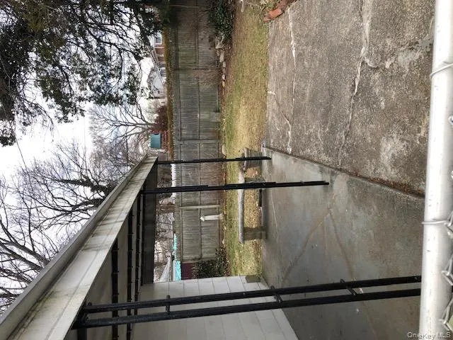 Fenced backyard with a patio area Fenced backyard with a patio area