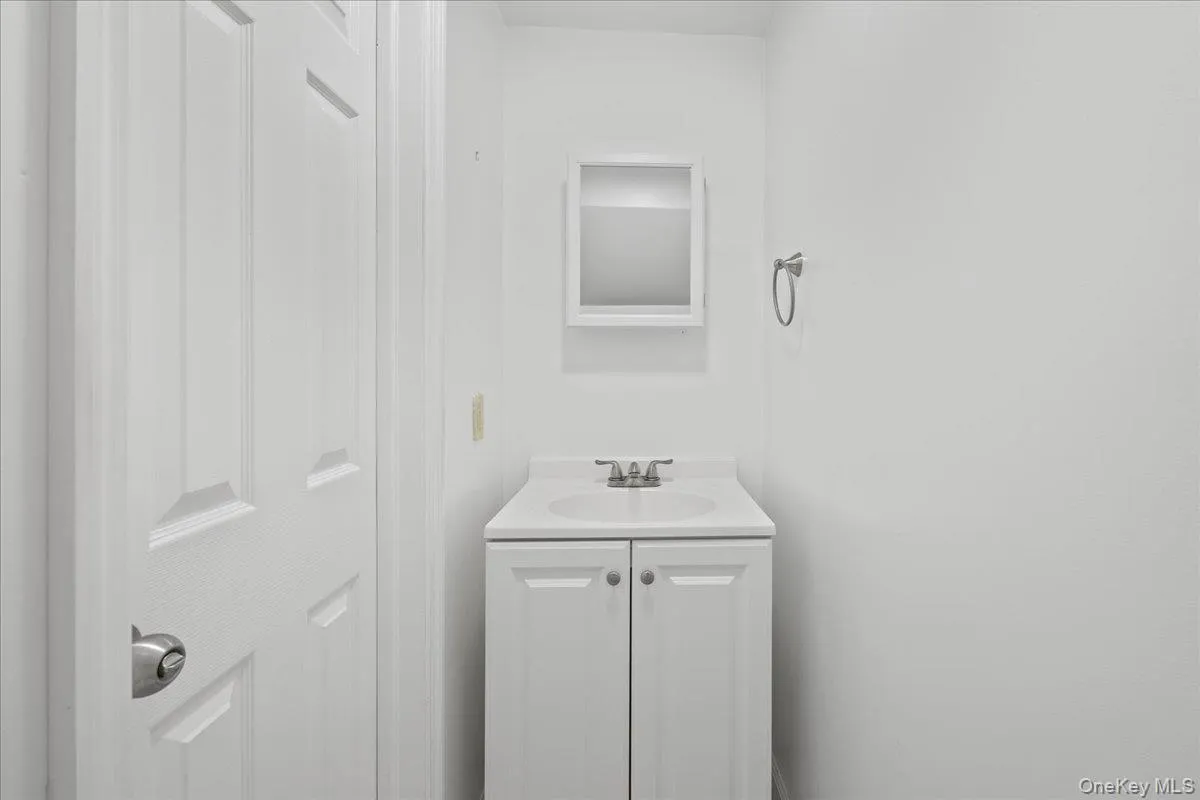 Bathroom featuring vanity Bathroom featuring vanity