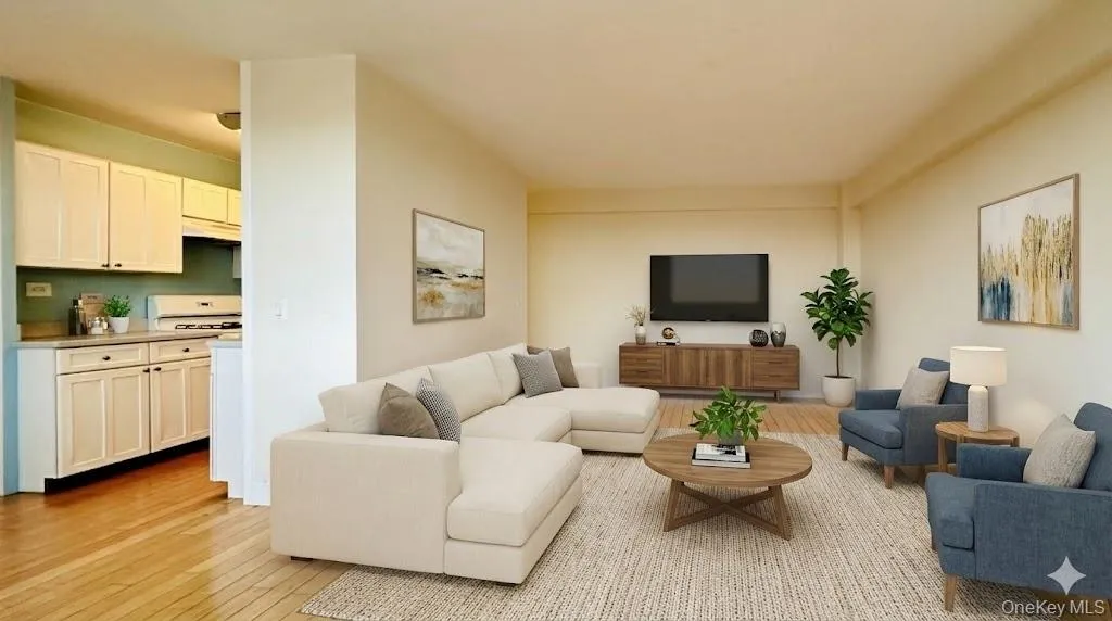 Living area with light wood finished floors Living area with light wood finished floors